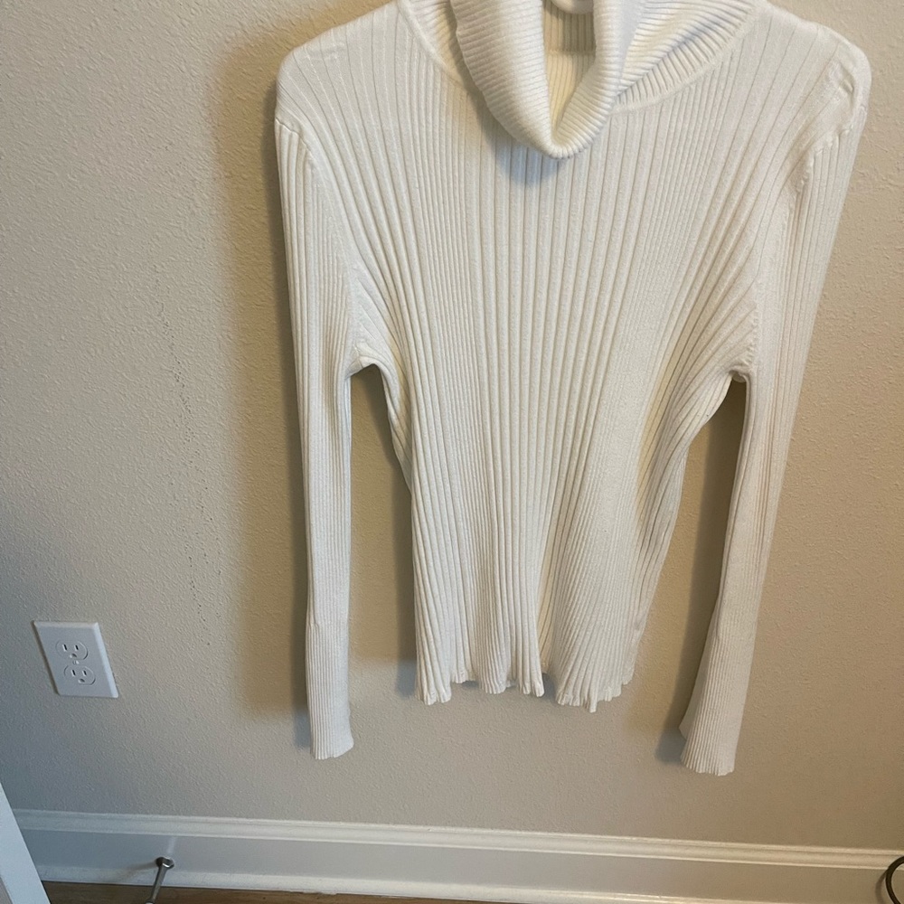 Off white turtleneck. Ribbed with slight button bell sleeve size L